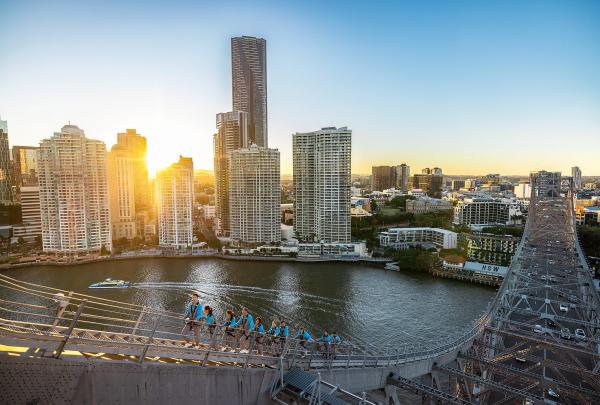 People climbing Brisbane's Story Bridge at sunset, Brisbane, Queensland © Tourism Australia
