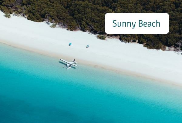 Aerial photograph of a seaplane on Whitehaven Beach, Whitsundays Islands, Queensland © Jason Hill/Tourism and Events Queensland
