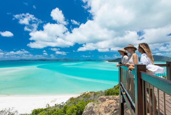 Group of women standing at a lookout overlooking Whitehaven Beach, Whitsundays, Queensland © Tourism and Events Queensland