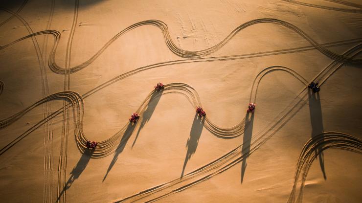 Aerial view of sand dune buggies on Stockton Beach, Port Stephens, New South Wales © Tourism Australia